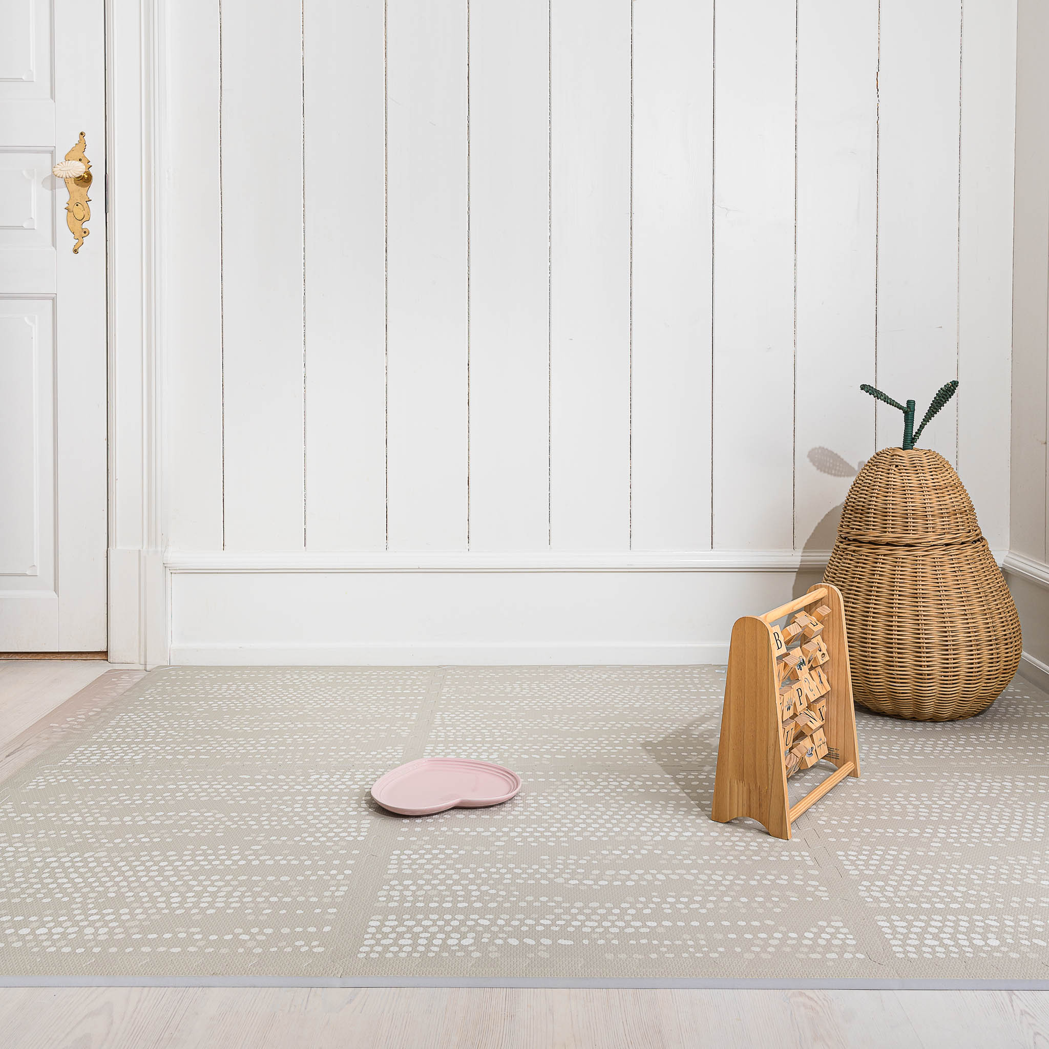 Dots Stone non-toxic foam play mat in Scandinavian nursery with wooden toys