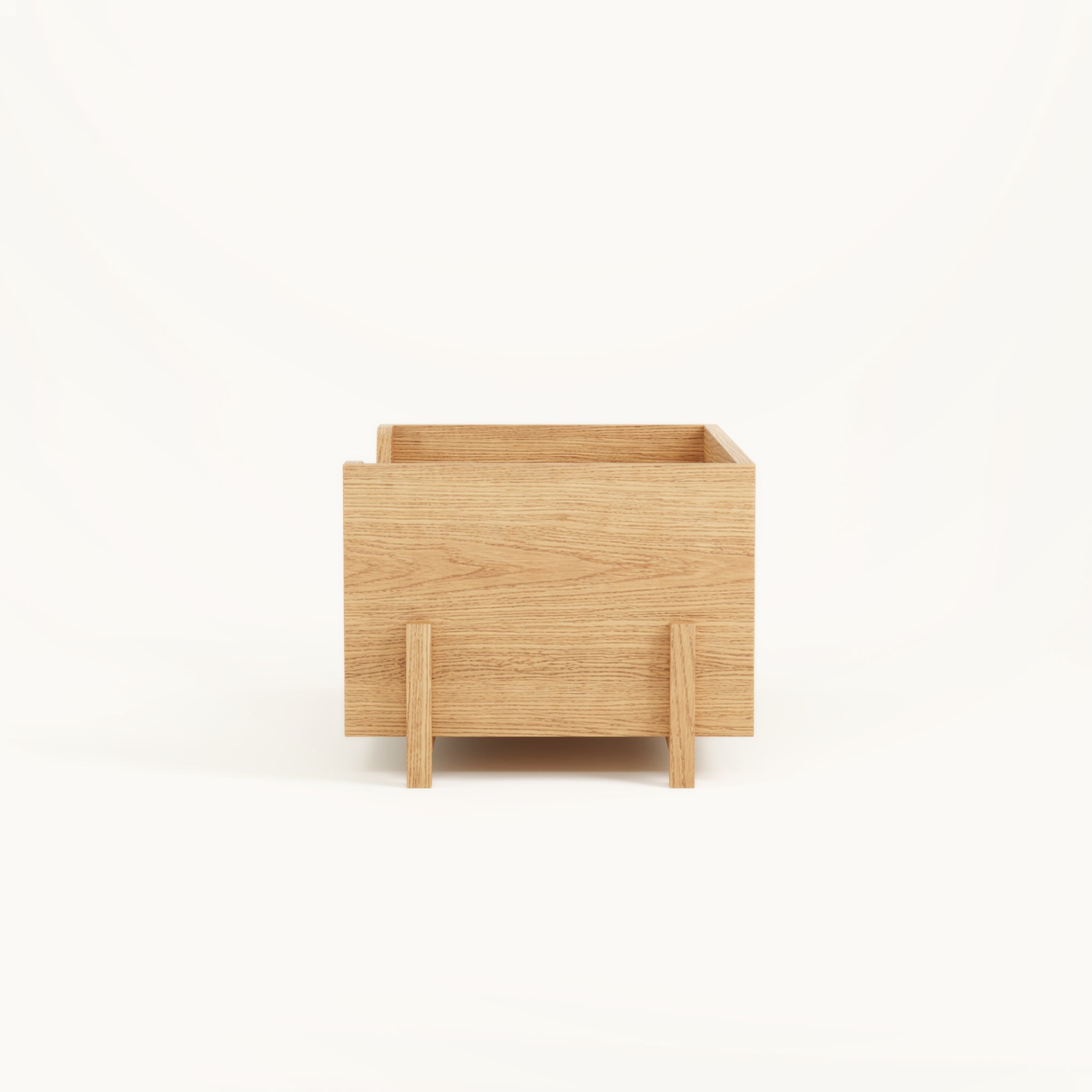 Side view of Kassen closed modular storage box in solid oak with clean architectural form and stackable design
