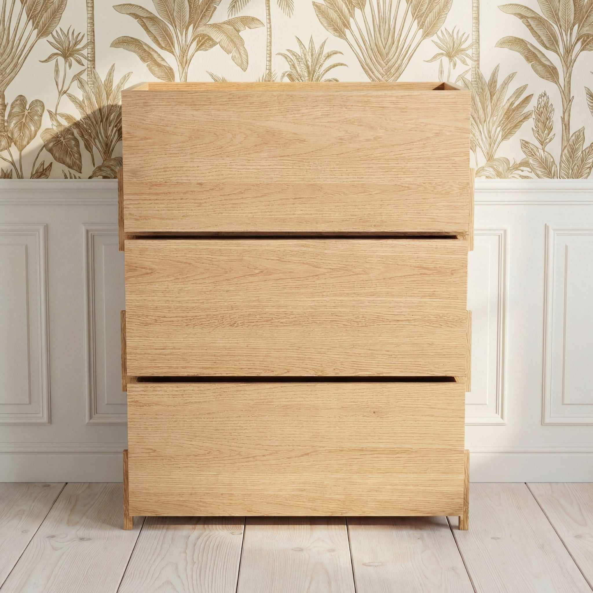 Three close Kassen wood storage boxes in a styled interior, solid oak Scandinavian storage system